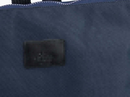 Detail of the waterproof backpack showcasing the navy fabric and zipper design.