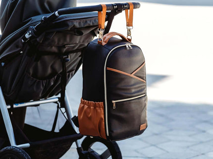 Stylish Large Diaper Backpack in Black Coffee hanging on a stroller, perfect for organized parents.