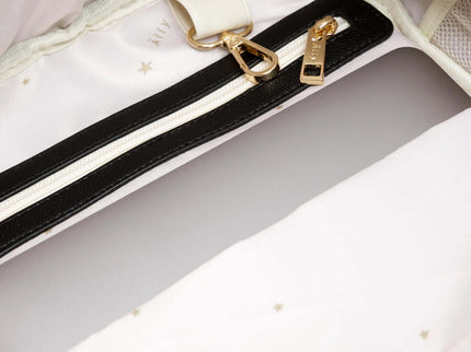 Interior view of a stylish diaper backpack with a zipper pocket and soft lining, ideal for organized parenting.