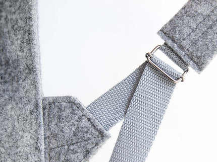 Close-up of the adjustable strap and material details of the Grey Lund Backpack, showcasing its modern design.