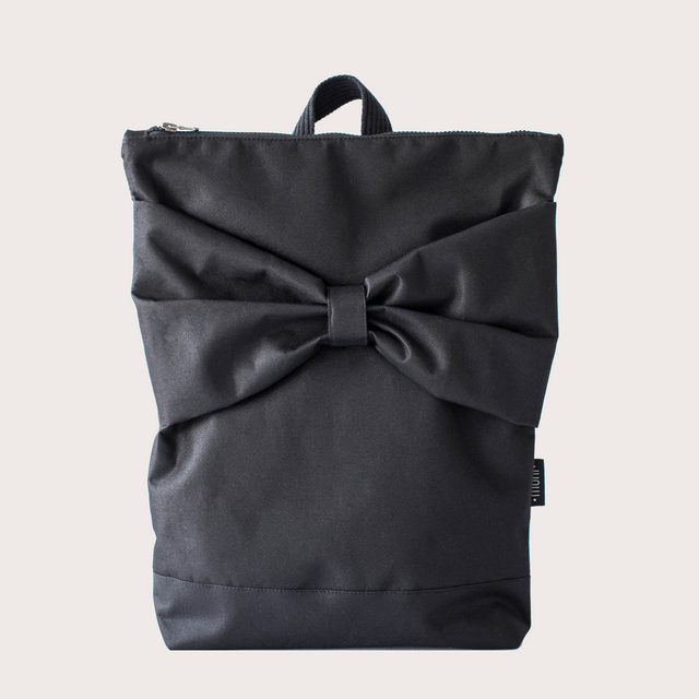 Stylish waterproof black backpack with a large bow, perfect for work and everyday use.