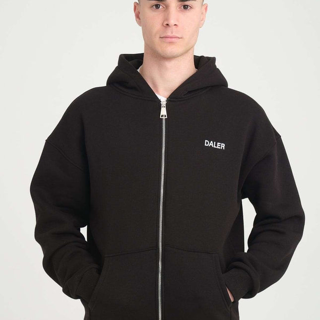 Basic heavyweight black zipper hoodie with DALER embroidery, oversized fit, worn by male model in studio.