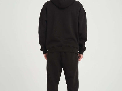 Model wearing Basic Heavyweight Zipper Hoodie in Black, showcasing an oversized fit and DALER embroidery on the chest.