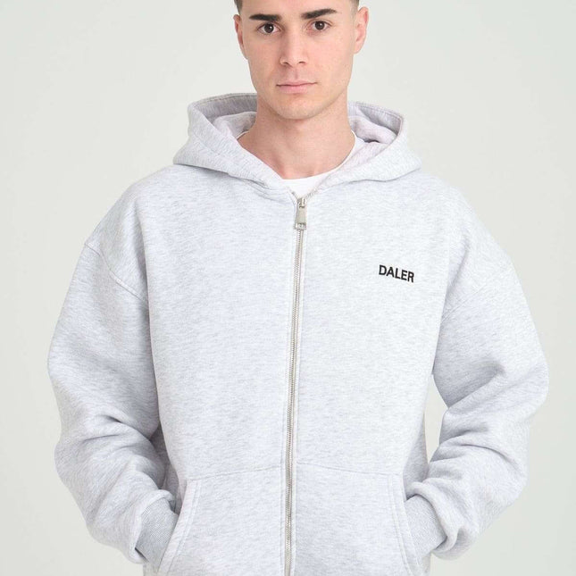 Basic heavyweight zipper hoodie in grey melange on male model with DALER embroidery, perfect for casual wear.
