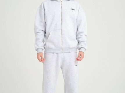Basic heavyweight grey melange zipper hoodie on a male model, showcasing oversized fit and DALER embroidery.