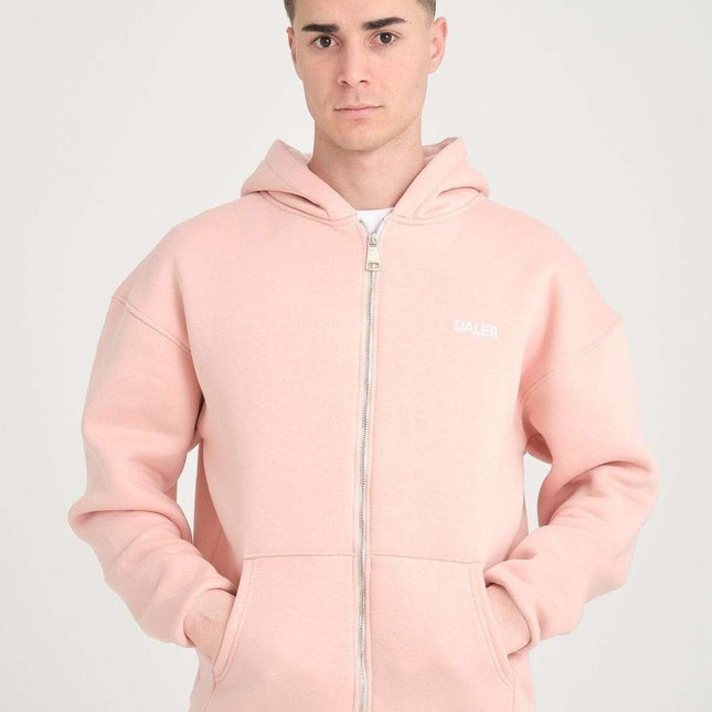 Male model wearing a basic heavyweight pink zipper hoodie with DALER embroidery, featuring an oversized fit.