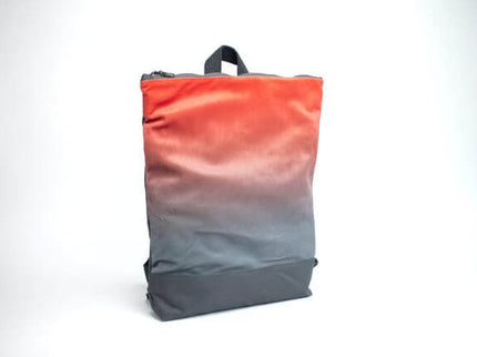 Faux leather salmon and gray gradient backpack perfect for daily use and stylish carry.