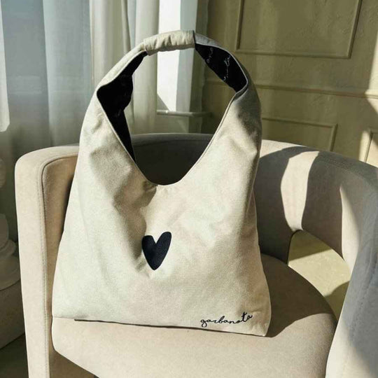 Garbanota Moon white crescent-shaped handbag