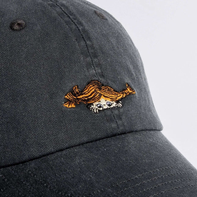 Close-up of Pippi Denim Dad Cap in black featuring playful embroidered design of Pippi Longstocking.