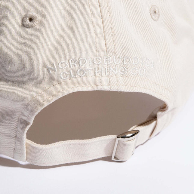 Back view of Pippi Longstocking Dad Cap showing adjustable strap and Nordicbuddies logo in soft natural white.