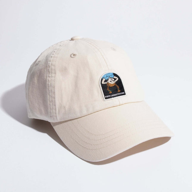 Pippi Longstocking Dad Cap in natural white with iconic character patch, 100% cotton, adjustable strap.