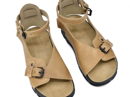 TOKU Athens Sandals in beige with adjustable ankle strap and closed heel for comfort and style.