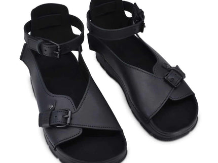 TOKU Athens Sandals in black with adjustable ankle strap and closed heel for stylish comfort.