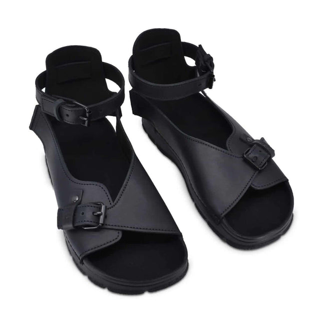 TOKU Athens Sandals in black with adjustable ankle strap and closed heel for stylish comfort.